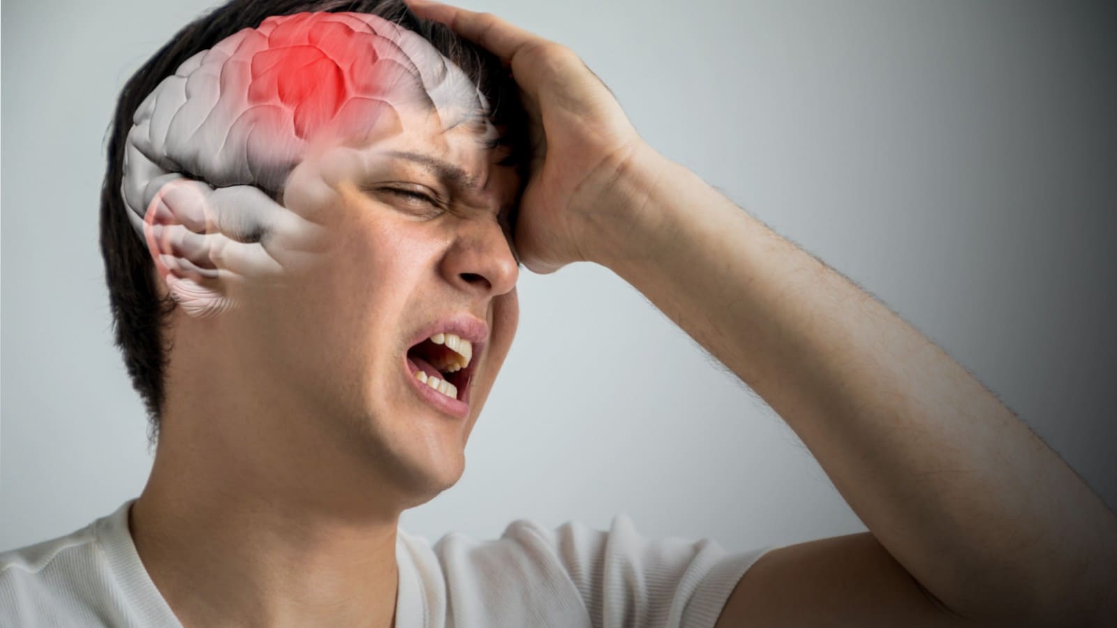Man with headache with an illustration of a brain