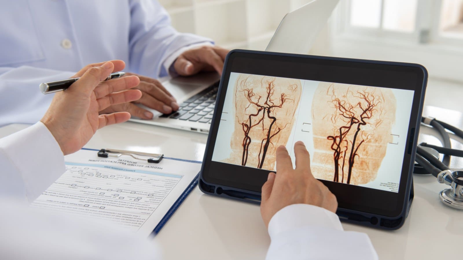 Doctor with a tablet that has a brain diagram