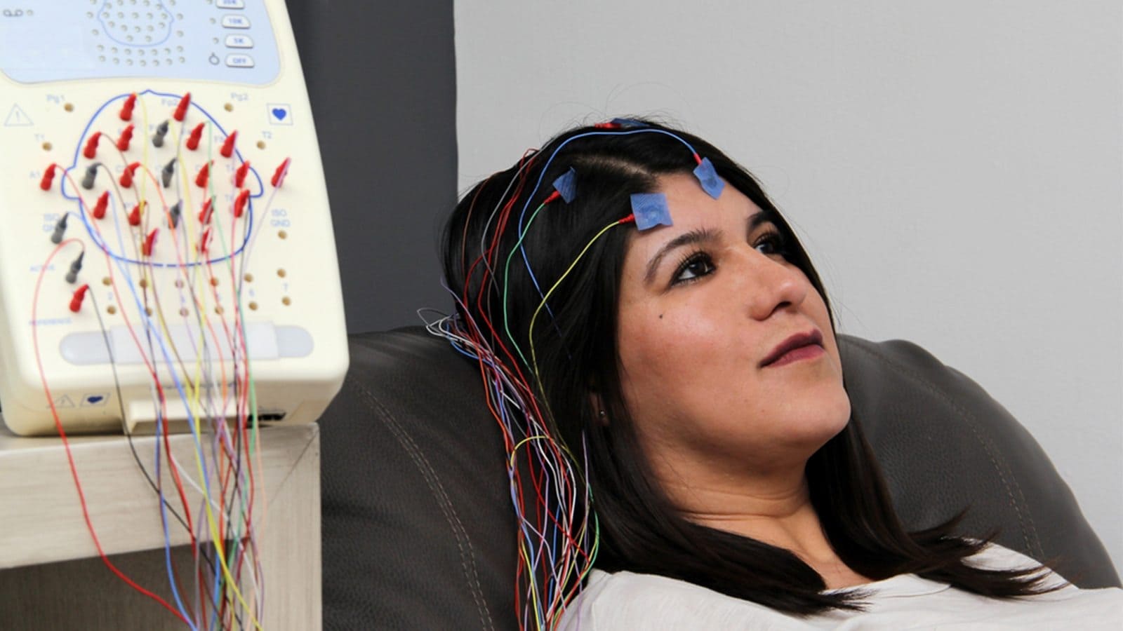 A woman on an EEG test at home