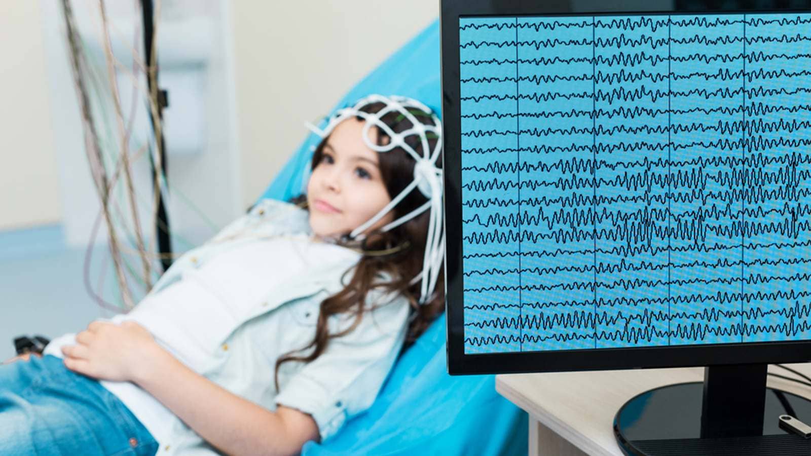 Little girl with her brain waves recorded in an EEG