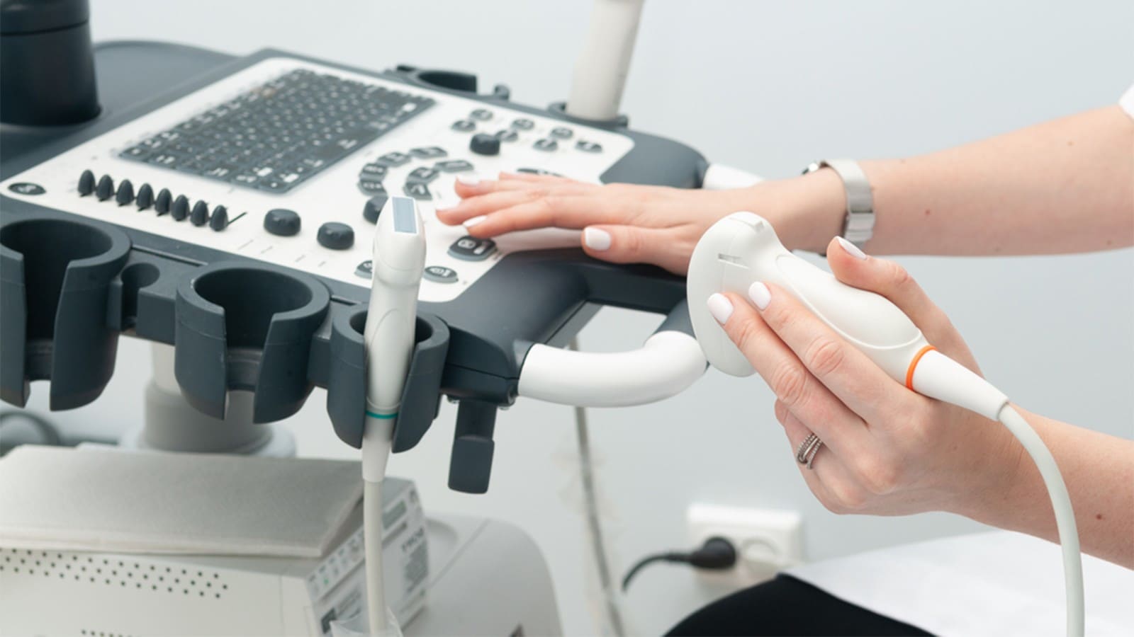 Hand holding probe of the ultrasound machine